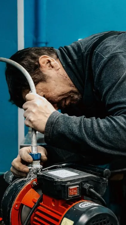 Technician working on a water pump