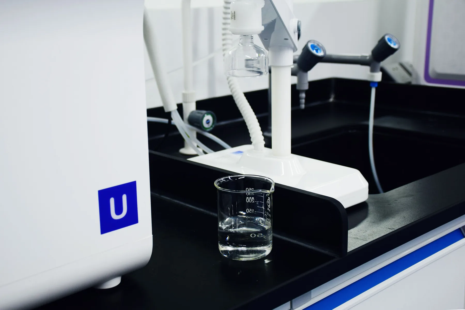 Water purification equipment with a sample beaker